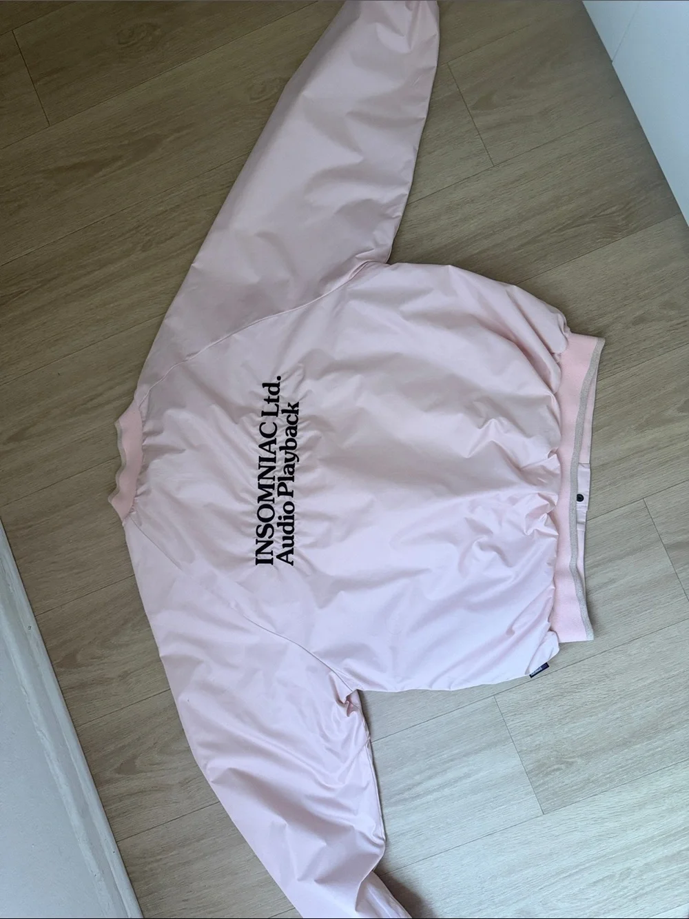 Insomniac LTD Audio Playback Light Pink Bomber Jacket with Embroidered Logo
